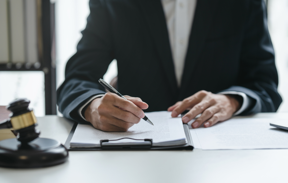 Solicitor writing in a document