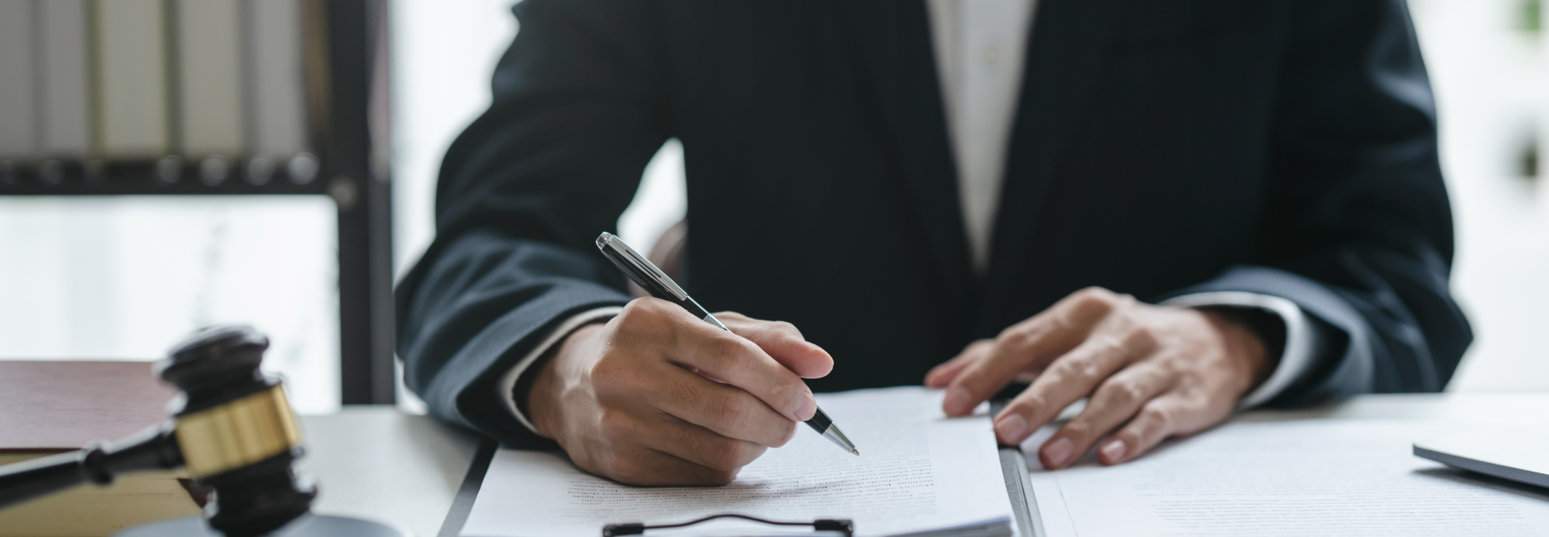 Lawyer writing in a document